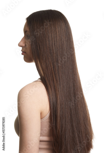 Teenage girl with healthy long hair on white background