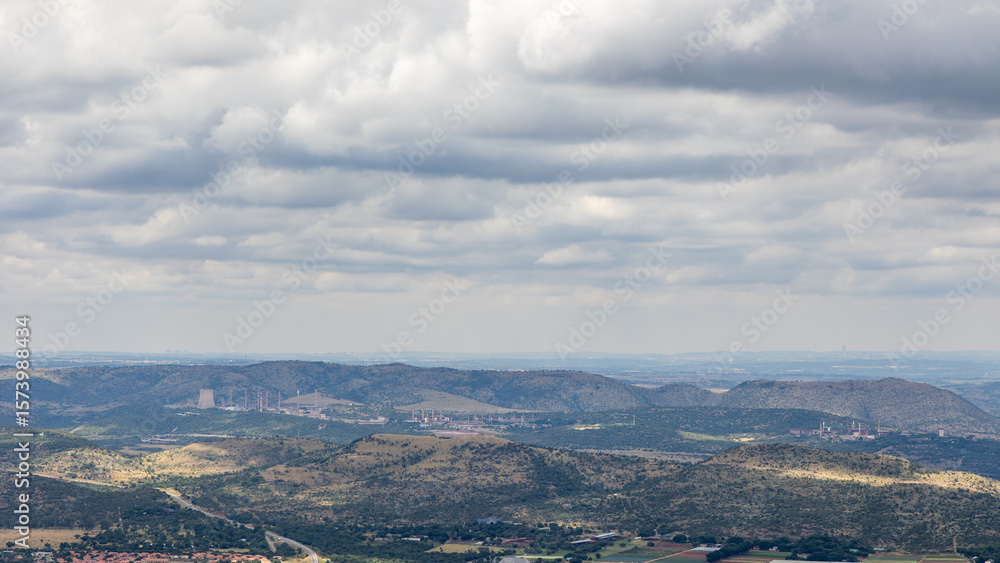 Fototapeta premium A repurposed uranium enrichment plant called Valindaba or Pelindaba East which once produced a number of nuclear weapons, seen in the distance from the Magaliesberg near Johannesburg in South Africa.