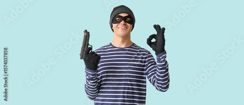 Male thief with gun showing...