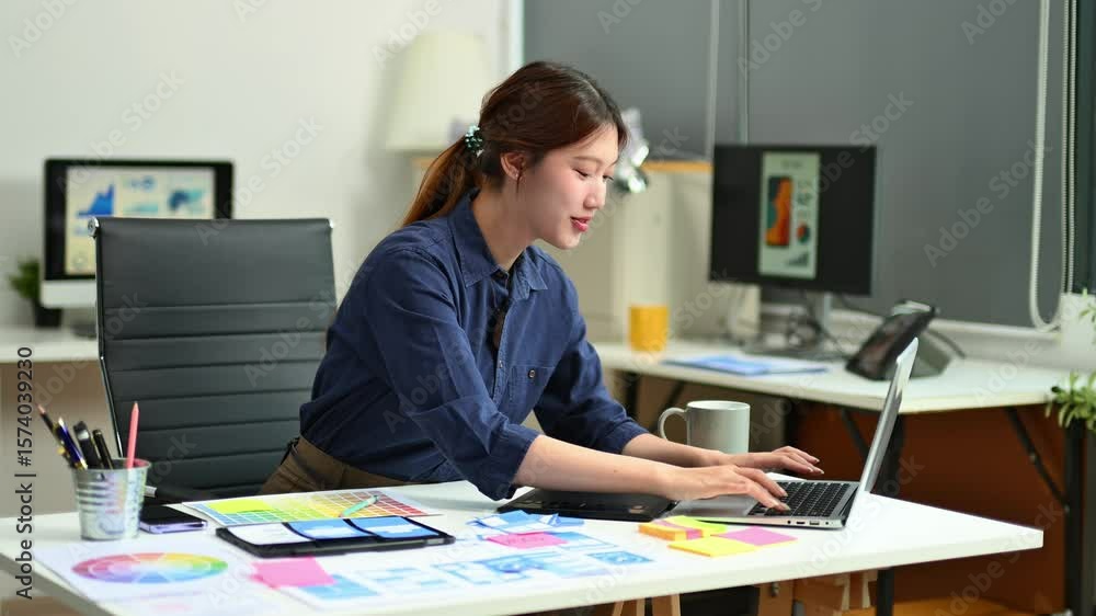 UX UI designer planning mobile layout with sticky notes in modern office. Creative brainstorming and prototyping workflow. UX UI designer planning mobile layout with sticky notes in modern office. Creative brainstorming and prototyping workflow.