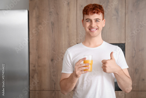 Young redhead man with glas...
