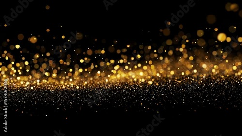 An abstract display of shimmering gold particles set against a stark black background