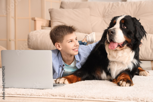 Cute fluffy dog and boy wit...