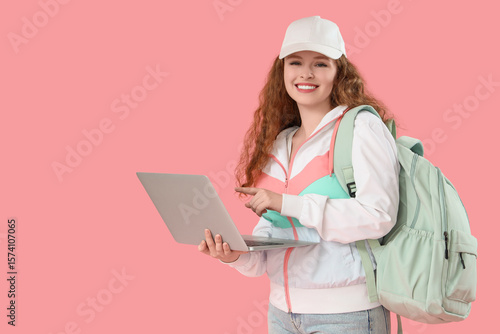 Happy female student with b...