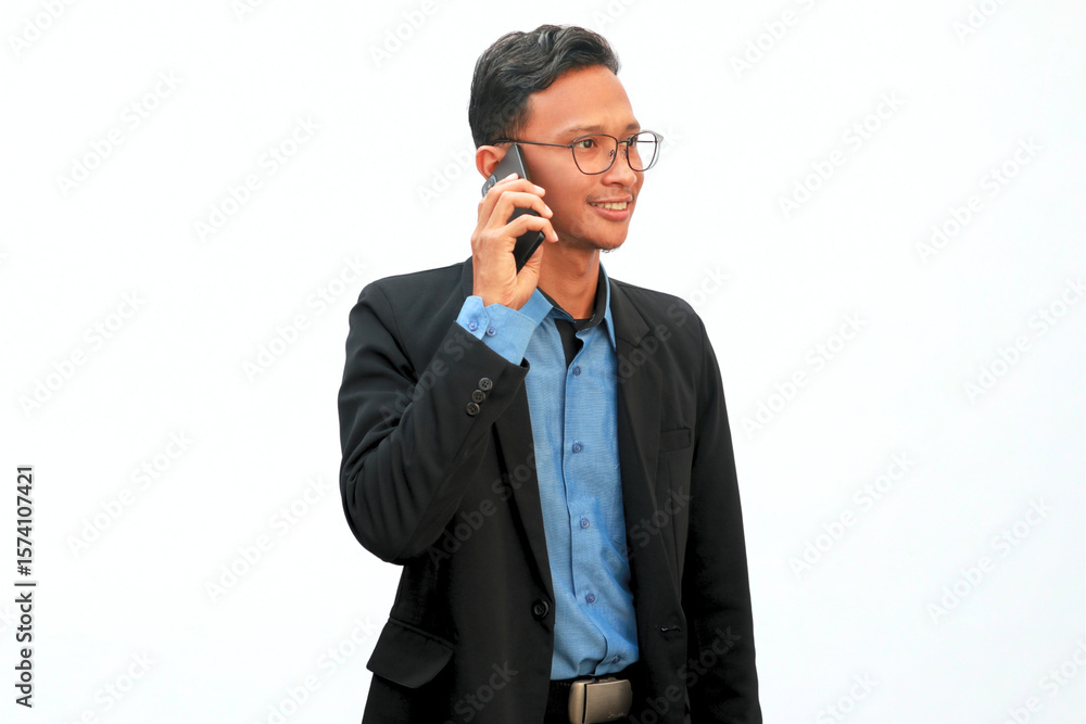 Asian businessman is making a phone call with a happy expression Asian businessman is making a phone call with a happy expression