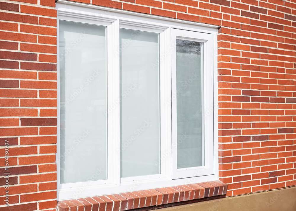 Fototapeta premium Real modern house window frame in a new brick house.