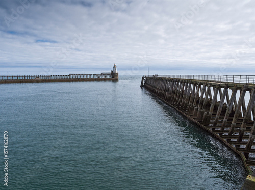 Entrance to Port of Blyth with piers and lighthouse, Northmberland, UK