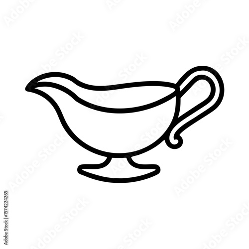 Thanksgiving gravy boat pouring sauce at holiday dinner table