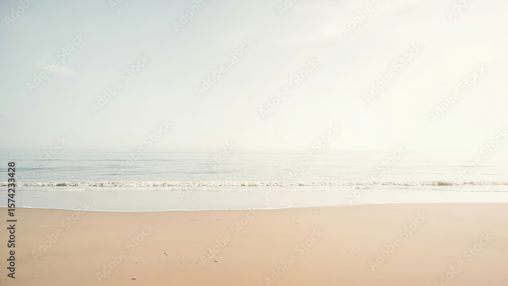 Sandy beach with gentle waves meeting the shore under a hazy sky serene coastal landscape with soft colors and a tranquil atmosphere Sandy beach with gentle waves meeting the shore under a hazy sky serene coastal landscape with soft colors and a tranquil atmosphere