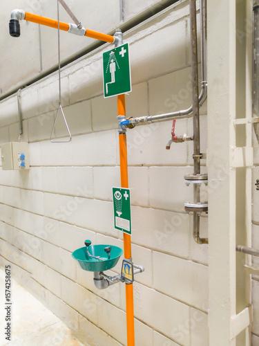 shower and eyewash with basin, installed in a company for workers' safety.
