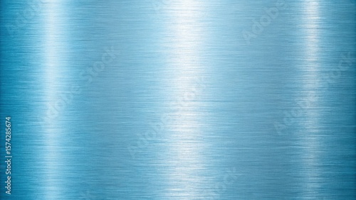 Closeup of a brushed blue metal texture with a gradient of light reflection