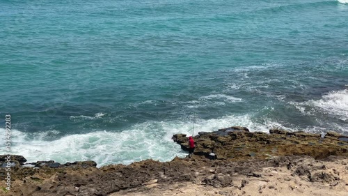 4K video Scenic view of Cap Spartel's lighthouse in front of the ocean surrounded by greenery on a sunny day - Tangier, Morocco