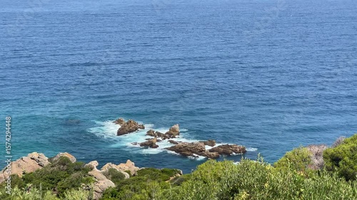 4K video Scenic view of Cap Spartel's lighthouse in front of the ocean surrounded by greenery on a sunny day - Tangier, Morocco
