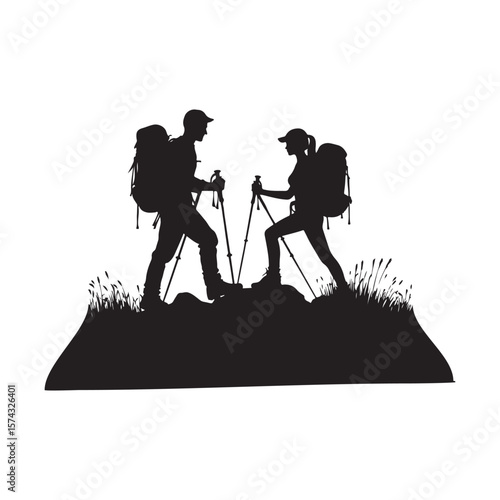 Silhouettes of a couple hiking together on a grassy hill with trekking poles