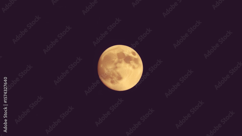 Fototapeta premium Bright full moon illuminates the night sky showcasing its detailed surface features and glowing appearance