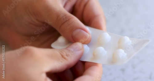 Man Taking Out a Single White Pill | 4K Slow Motion