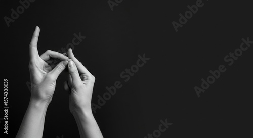 hands in sign language gestures, monochrome background with copy area