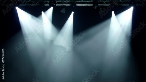 Cinematic stage spotlights with swirling fog and shifting beams