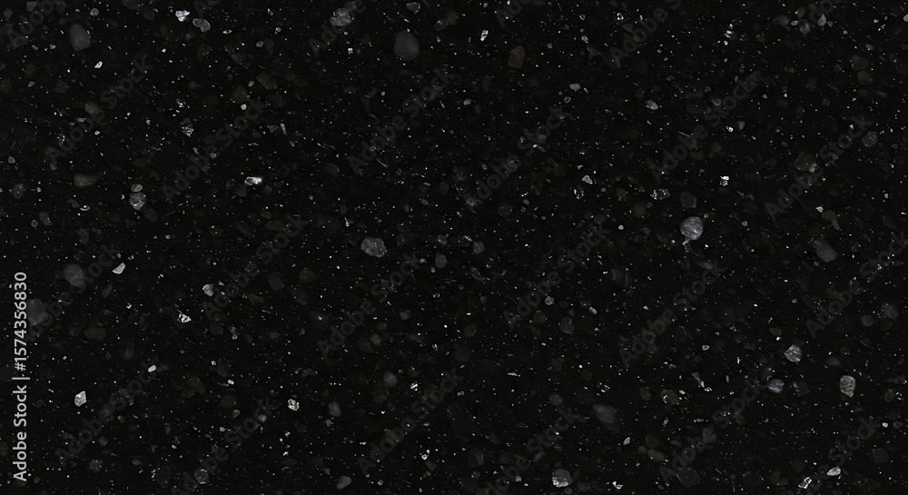 Fototapeta premium Close-up view of a dark speckled surface, resembling a night sky.