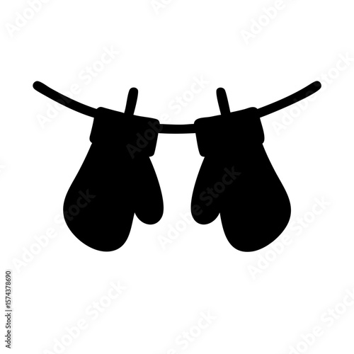 Black silhouette of mittens hanging on a line