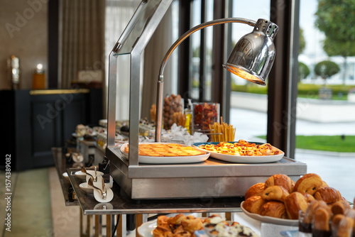 A buffet with a variety of pastries at a hotel or event.