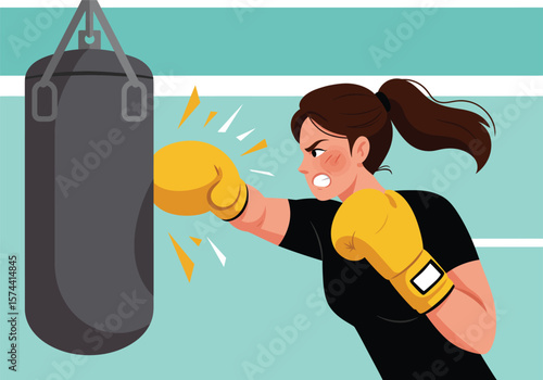 Determined Woman Punches Boxing Bag with Focused Intensity.