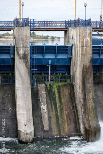 Wallpaper Mural Overflow gate opened on a big concrete dam. Large volume of water flowing at high pressure. Torontodigital.ca