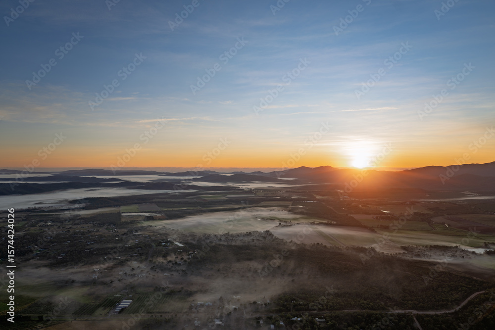 Fototapeta premium Atherton Tablelands, North Queensland, foggy morning sunrise, aerial view from hot air balloon