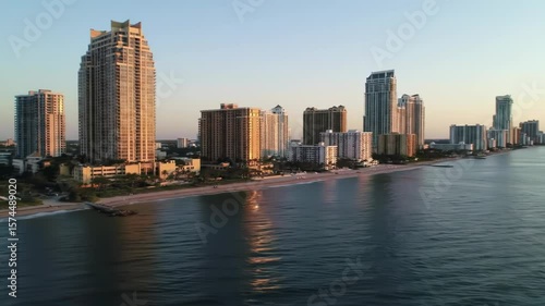 Wallpaper Mural Coastal city skyline at dawn with high-rise buildings lining a beach Torontodigital.ca