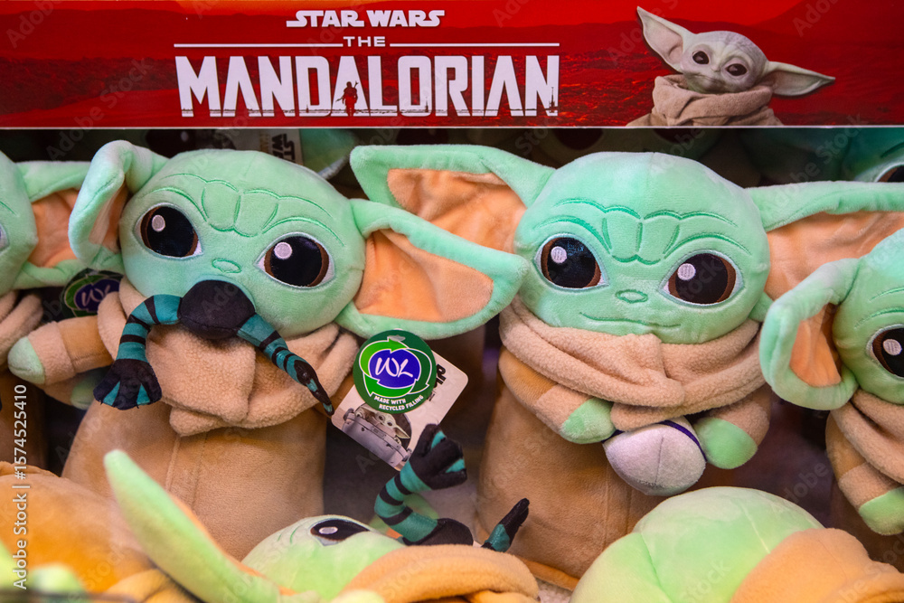 Naklejka premium Grogu Plush Toys in an Arcade Machine