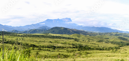 Wide Panorama of Mount Kinabalu Rising Above the Lush Rolling Hills of Sabah, Borneo, Malaysia