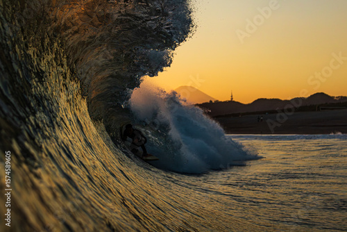 Surfer at Sunset with Mount Fuji