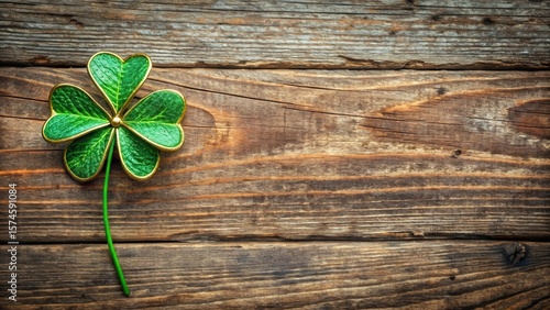 Stylish green clover with gold trim surrounded by modern rustic wooden background, trim, clover,  trim,clover, botanical