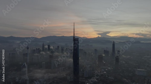 Wallpaper Mural Establishing aerial cinematic b-roll shot of sunrise at Kuala Lumpur city skyline with highest building in Asia Torontodigital.ca