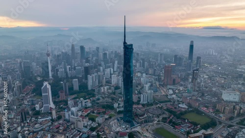 Wallpaper Mural Aerial view time lapse 4k video of Kuala Lumpur city center view during dawn overlooking the city skyline in Federal Territory, Malaysia.  Torontodigital.ca