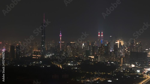 Aerial view of night scene at Kuala Lumpur with fireworks show. 