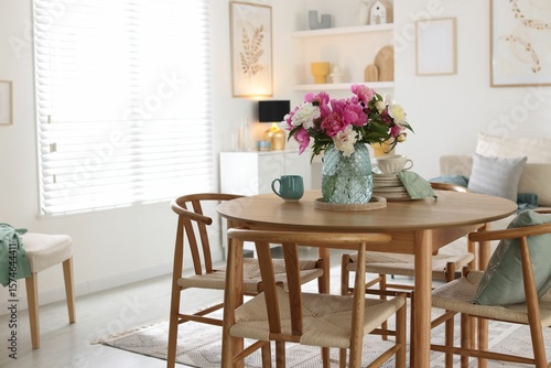 Wallpaper Mural Dining table with beautiful flowers and dishware in room. Interior design Torontodigital.ca