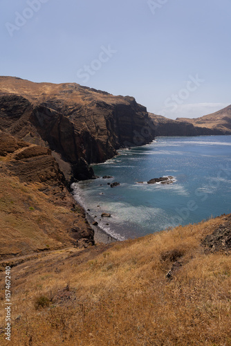 Ocean cliffs under clear summer sky