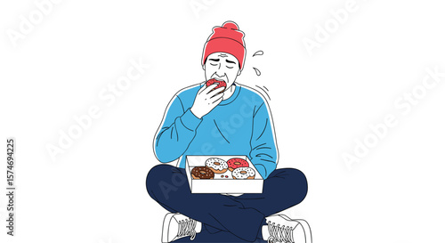 Young man sitting cross-legged eating a donut from a box of assorted pastries feeling overwhelmed