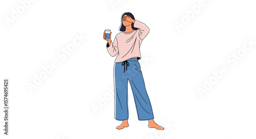 Young woman wearing comfortable pajamas holding a cup of coffee while standing barefoot in a bright room