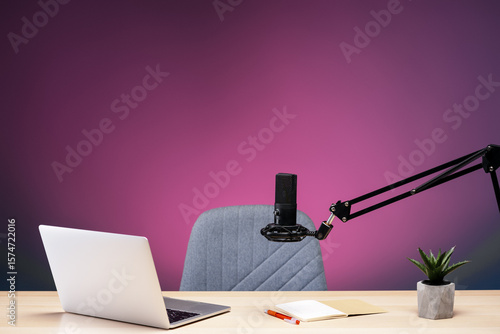 Papier peint Professional microphone, laptop, and notebook on a desk preparing for recording
