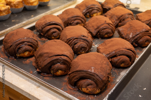 Photography Assortment of chocolate croissants coated in chocolate and cocoa powder