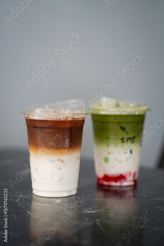 Wallpaper Mural Close up glass of ice matcha green tea with jelly, iced latte on black marble table of a coffee shop summer terrace, menu photography. Torontodigital.ca
