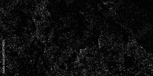 Grungy black surface with numerous white crack and scratches and dust particles distressed background. abstract chalk rubbed out on blackboard for background. dirty grunge texture vector. black paper.
