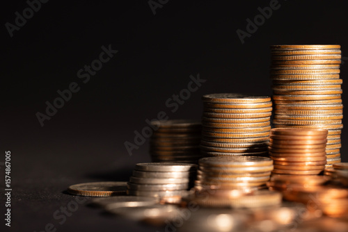 Stack of golden coins isolated on black background