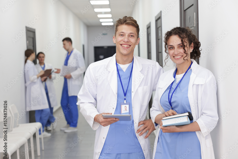 Obraz premium Medical students in uniforms indoors, selective focus