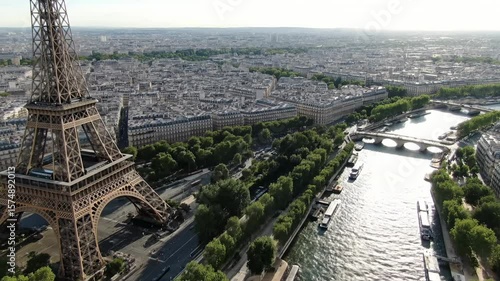 Aerial drone view of Eiffel Tower and Seine River in historical city center of Paris from above

