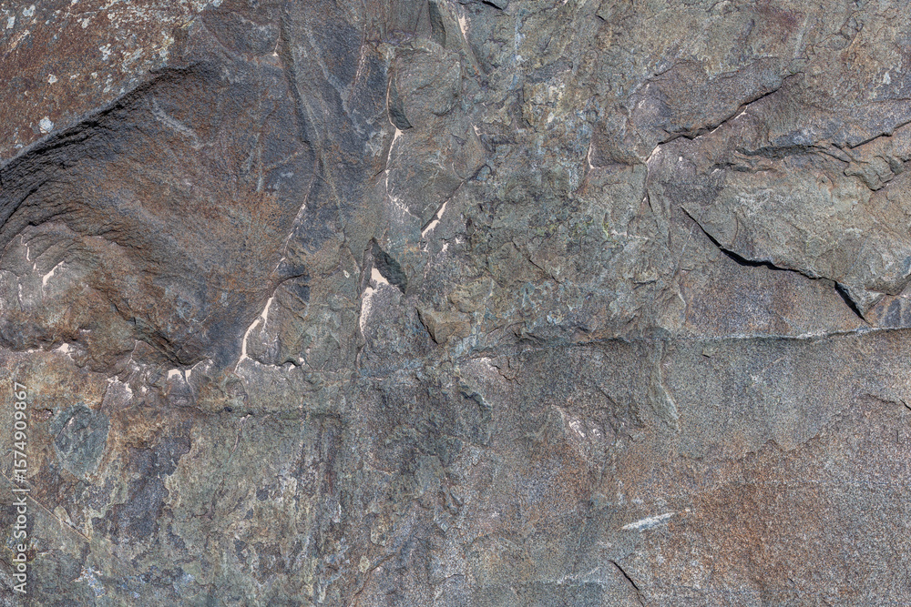 Naklejka premium Rough solid sedimentary rock face texture and background