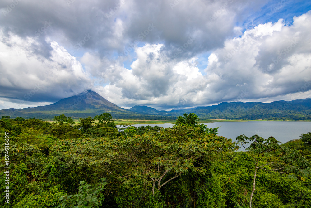 Fototapeta premium Panoramic view of Arenal Volcano National Park in Costa Rica, with the volcano and Arenal Lagoon in the background