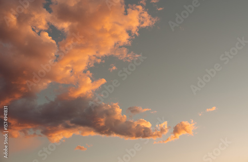 Fototapeta Naklejka Na Ścianę i Meble -  Evening dusk clouds during sunset, idyllic nature clouds, dramatic sunlight with majestic peaceful sky in summer season